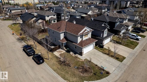 Two-story residence featuring light gray siding and a brown shingle roof - 55 Lamplight Cove, Spruce Grove, AB - Outdoor
