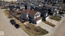 Two-story residence featuring light gray siding and a brown shingle roof - 55 Lamplight Cove, Spruce Grove, AB  - Outdoor 