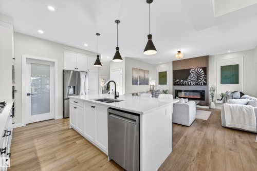 117 Kidd Crescent, Leduc, AB - Indoor Photo Showing Kitchen With Fireplace With Double Sink With Upgraded Kitchen