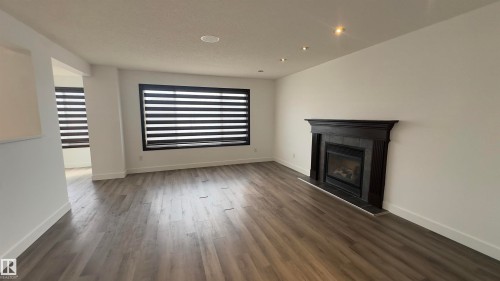 20015 50 Avenue, Edmonton, AB - Indoor Photo Showing Living Room With Fireplace