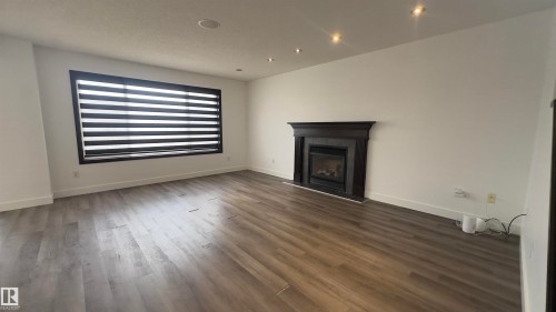 20015 50 Avenue, Edmonton, AB - Indoor Photo Showing Living Room With Fireplace