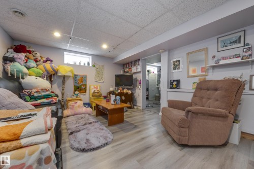 Finished space featuring light wood-finish flooring, recessed lighting, and a drop ceiling - 11516 72 Avenue, Edmonton, AB - Indoor Photo Showing Other Room