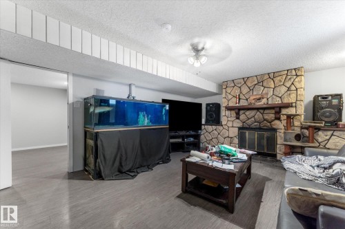 4520 54 Avenue, Leduc, AB - Indoor Photo Showing Living Room With Fireplace