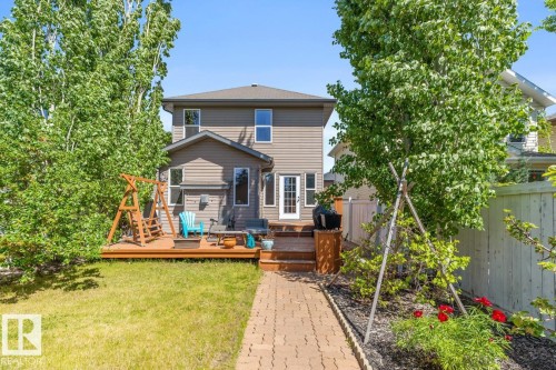 Rear exterior featuring a spacious wooden deck with direct access to the interior - 7641 Schmid Crescent, Edmonton, AB - Outdoor With Deck Patio Veranda