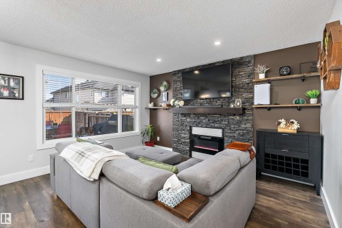 6306 60 Avenue, Beaumont, AB - Indoor Photo Showing Living Room With Fireplace