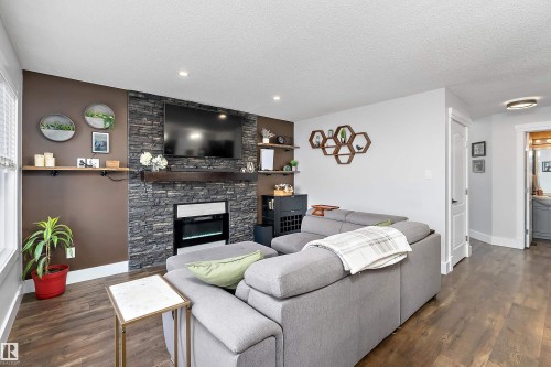 6306 60 Avenue, Beaumont, AB - Indoor Photo Showing Living Room With Fireplace