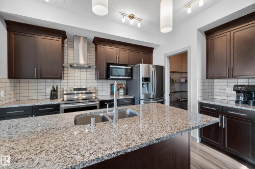 934 Berg Place, Leduc, AB - Indoor Photo Showing Kitchen With Stainless Steel Kitchen With Double Sink With Upgraded Kitchen