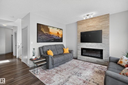 934 Berg Place, Leduc, AB - Indoor Photo Showing Living Room With Fireplace