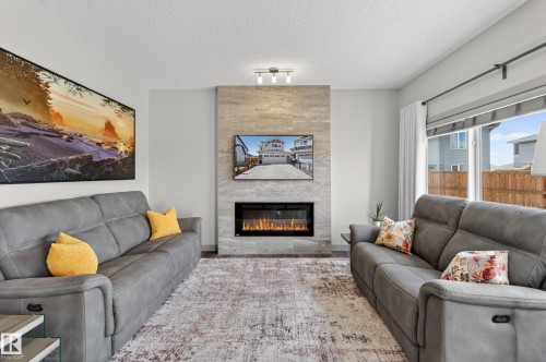 934 Berg Place, Leduc, AB - Indoor Photo Showing Living Room With Fireplace