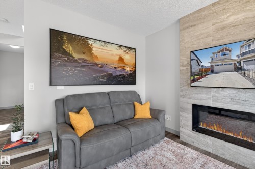 934 Berg Place, Leduc, AB - Indoor Photo Showing Living Room With Fireplace