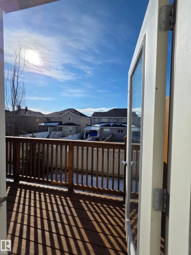 Outdoor deck featuring wood-finish flooring and a wood railing - 295 401 Southfork, Leduc, AB - Outdoor