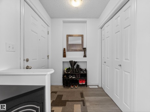 5576 Stevens Crescent Nw, Edmonton, AB - Indoor Photo Showing Other Room With Fireplace