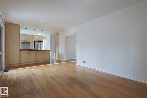 Hardwood flooring throughout the main living area - 11507 72 Avenue, Edmonton, AB - Indoor Photo Showing Kitchen