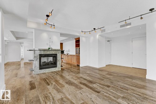 1900 10035 Saskatchewan Drive, Edmonton, AB - Indoor Photo Showing Other Room With Fireplace