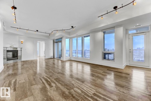 1900 10035 Saskatchewan Drive, Edmonton, AB - Indoor Photo Showing Other Room With Fireplace