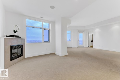 1900 10035 Saskatchewan Drive, Edmonton, AB - Indoor With Fireplace