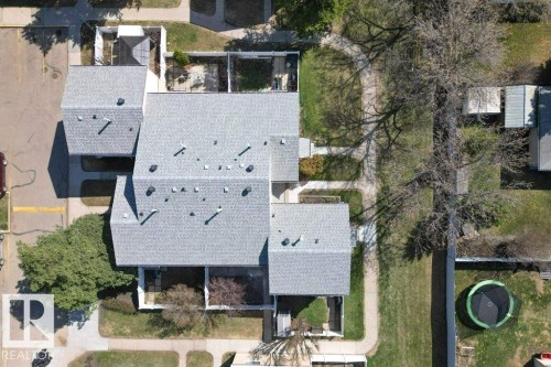 Aerial perspective highlighting the property's roofline and surrounding landscaping - 3E Twin Terrace, Edmonton, AB - Outdoor