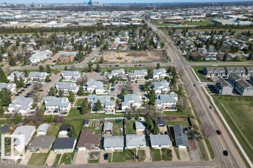Aerial perspective showcasing a residential area with varied housing structures, including single-family homes and multi-unit dwellings - 3E Twin Terrace, Edmonton, AB - Outdoor With View
