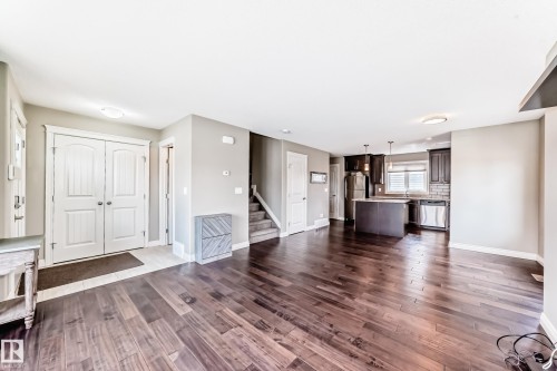 Open concept living area with wood-finish flooring - 10519 114 Avenue, Edmonton, AB - Indoor Photo Showing Other Room