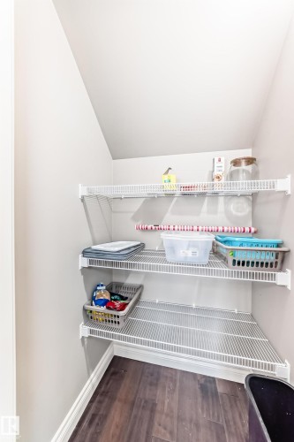 Under-stair storage area featuring multiple white wire shelving units - 10519 114 Avenue, Edmonton, AB - Indoor With Storage