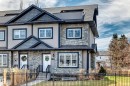 Modern multi-level exterior featuring stone veneer, horizontal siding, and dark trim accents - 10519 114 Avenue, Edmonton, AB  - Outdoor With Facade 