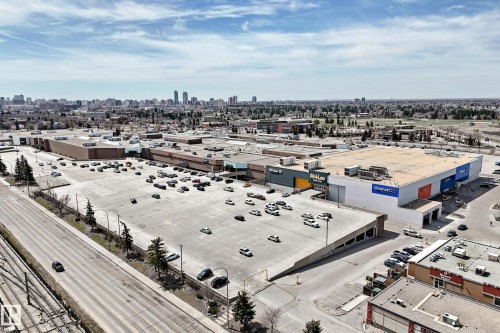 Large commercial retail center featuring multiple anchor stores and extensive surface parking - 10519 114 Avenue, Edmonton, AB - Outdoor With View