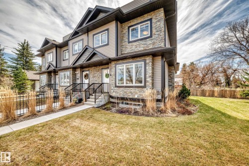 Stacked stone and siding exterior with dark trim accents - 10519 114 Avenue, Edmonton, AB - Outdoor