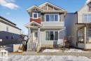 The property features a multi-toned facade with light gray siding, dark gray accents, and a section of red siding - 1778 25A Street, Edmonton, AB  - Outdoor 