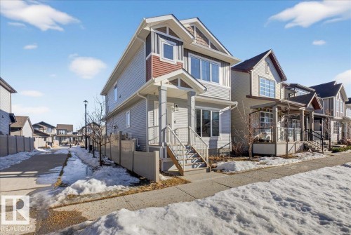 The property features multi-toned siding, a covered porch entrance, and prominent gables - 1778 25A Street, Edmonton, AB - Outdoor
