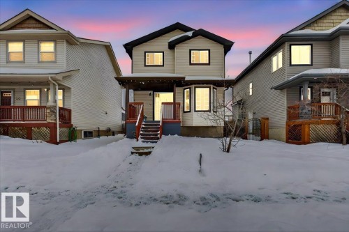 View of front of house featuring covered porch - 150 Acacia Circle, Leduc, AB - Outdoor With Deck Patio Veranda