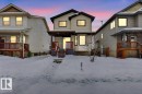 View of front of house featuring covered porch - 150 Acacia Circle, Leduc, AB  - Outdoor With Deck Patio Veranda 