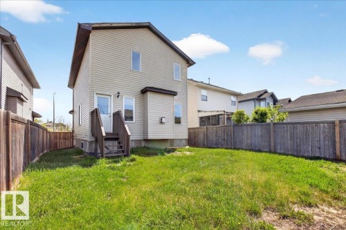Expansive backyard featuring a large grass area - 150 Acacia Circle, Leduc, AB - Outdoor