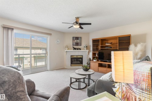 26 11 Hunchak Way, St. Albert, AB - Indoor Photo Showing Living Room With Fireplace