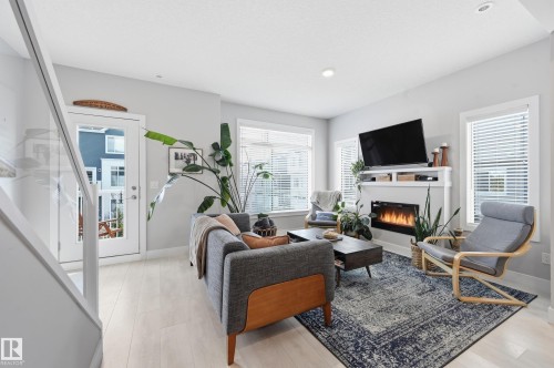 24 215 Saddleback Road, Edmonton, AB - Indoor Photo Showing Living Room With Fireplace