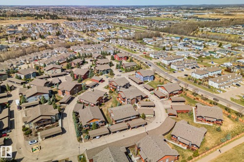 Aerial perspective showcasing a residential community with varying architectural styles - 2201 Graybriar Green, Stony Plain, AB - Outdoor With View
