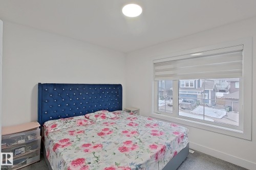 Window with white trim and integrated blind system - 1210 Peregrine Terrace, Edmonton, AB - Indoor Photo Showing Bedroom