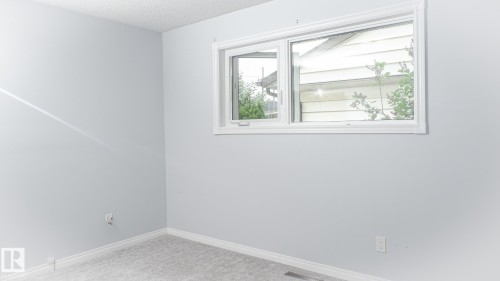 Room featuring light gray painted walls and matching gray carpet - 11131 52 Street, Edmonton, AB - Indoor Photo Showing Other Room