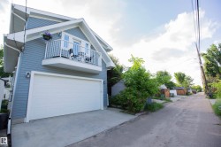 Contemporary detached structure featuring horizontal siding and a prominent dormer - 