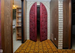 Archway featuring unique padded double doors - 