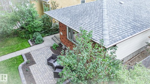 Brick exterior with gray shingle roof and white siding - 11131 52 Street, Edmonton, AB - Outdoor