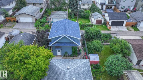 Two-story residential property featuring a blue exterior and a contrasting dark blue roof - 11131 52 Street, Edmonton, AB - Outdoor