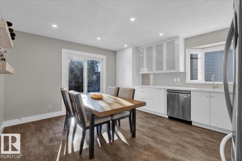 Dining area with a textured ceiling, recessed lighting, and dark wood-style floors - 3515 20 Avenue, Edmonton, AB - Indoor