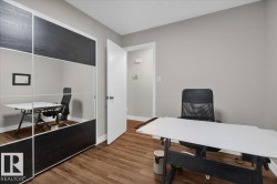 Home office with dark wood finished floors - 