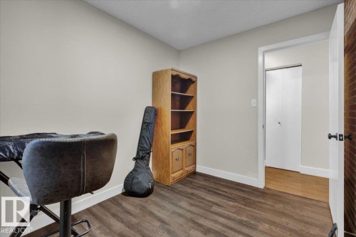 Home office with dark wood-style floors and a textured ceiling - 3515 20 Avenue, Edmonton, AB - Indoor