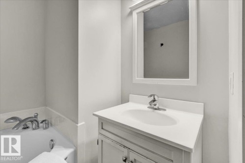 Full bathroom featuring vanity and a garden tub - 3515 20 Avenue, Edmonton, AB - Indoor Photo Showing Bathroom