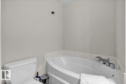 Bathroom with a garden tub and toilet - 