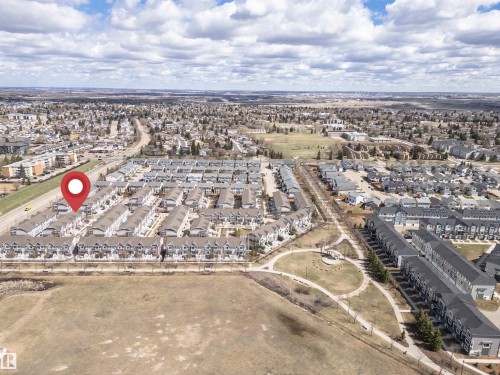 Aerial perspective showcasing a residential community with numerous townhome-style properties - 110 3625 144 Avenue, Edmonton, AB - Outdoor With View