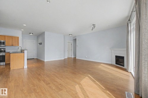 411 10033 110 Street, Edmonton, AB - Indoor Photo Showing Kitchen With Fireplace