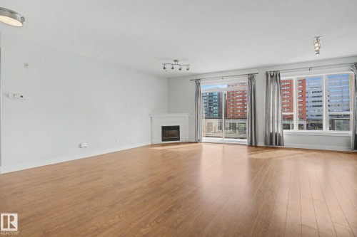 411 10033 110 Street, Edmonton, AB - Indoor Photo Showing Living Room With Fireplace