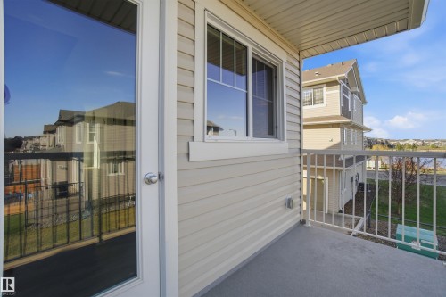 Private balcony featuring a concrete floor, white metal railings, and vinyl siding exterior - 64 17832 78 Street, Edmonton, AB - Outdoor With Balcony With Exterior